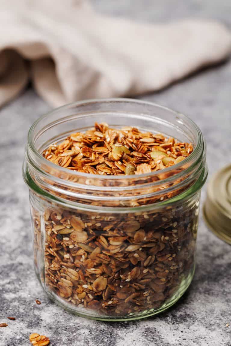 A glass jar with granola.