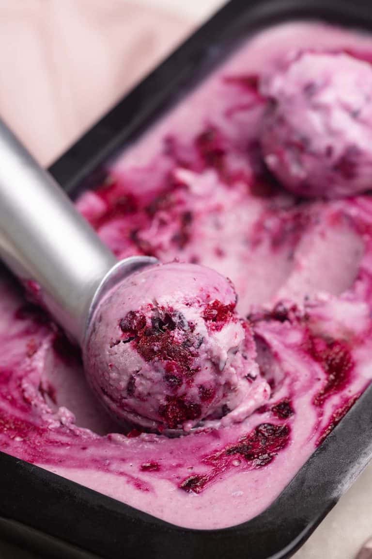 Close-up of a scoop of boysenberry ice cream.