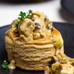 Mini chicken pot pie a black plate.