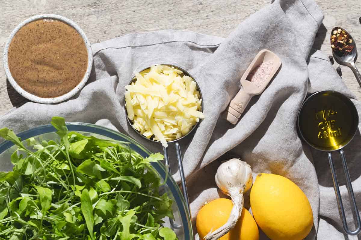 Creamy lemon pasta ingredients on a linen tea towel.