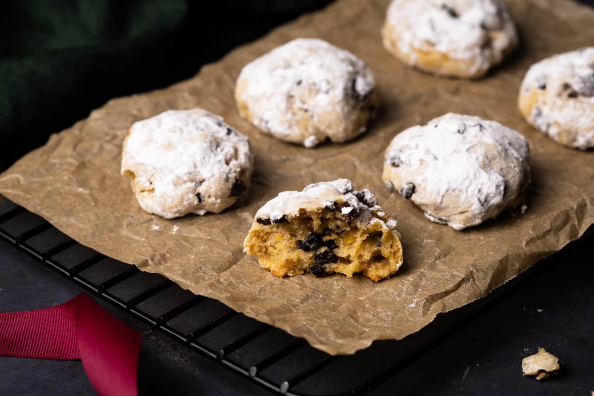 A tray of stollen cookies next to a napkin.