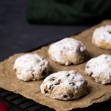 A tray of stollen cookies next to a napkin.