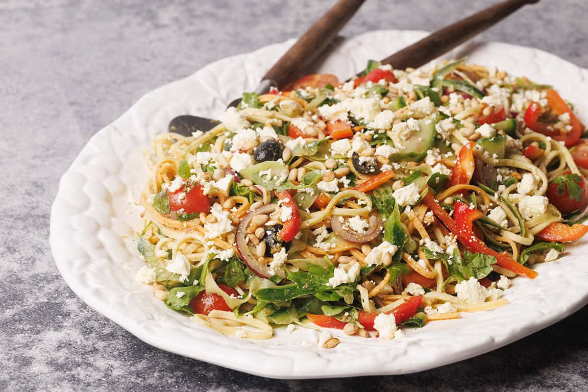 Linguine salad on a large white platter.
