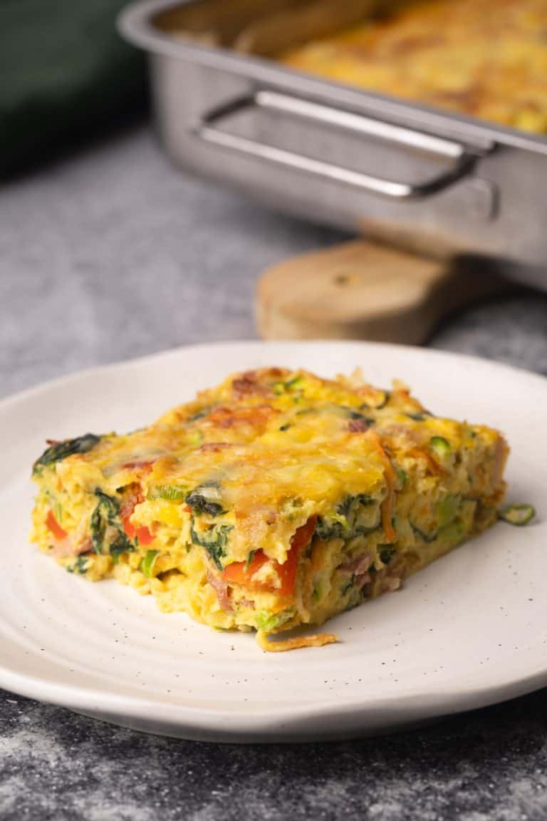 A slice of veggie egg bake in a plate.