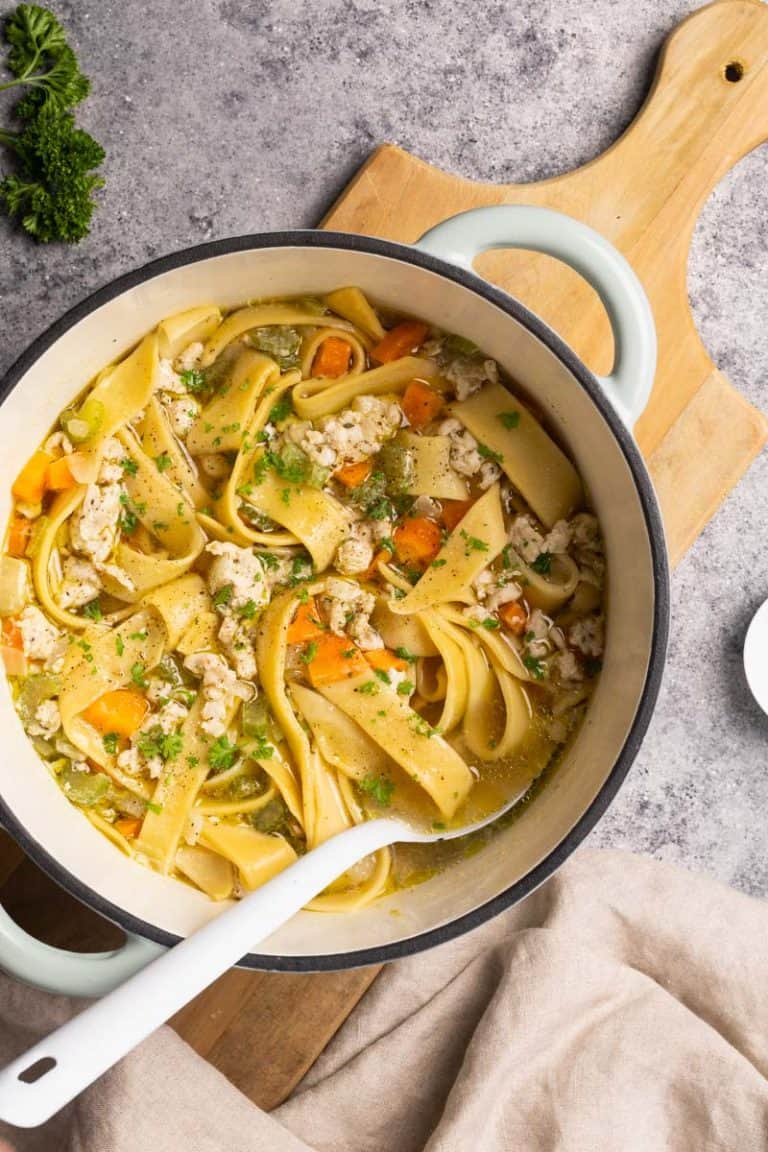 Chicken soup with noodles in a large Dutch oven.