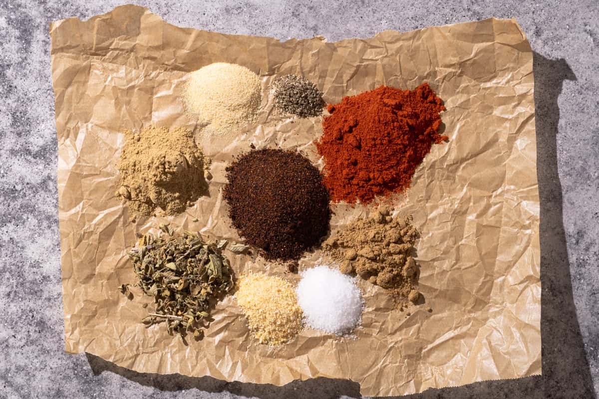 Chipotle spice mix ingredients on parchment paper.