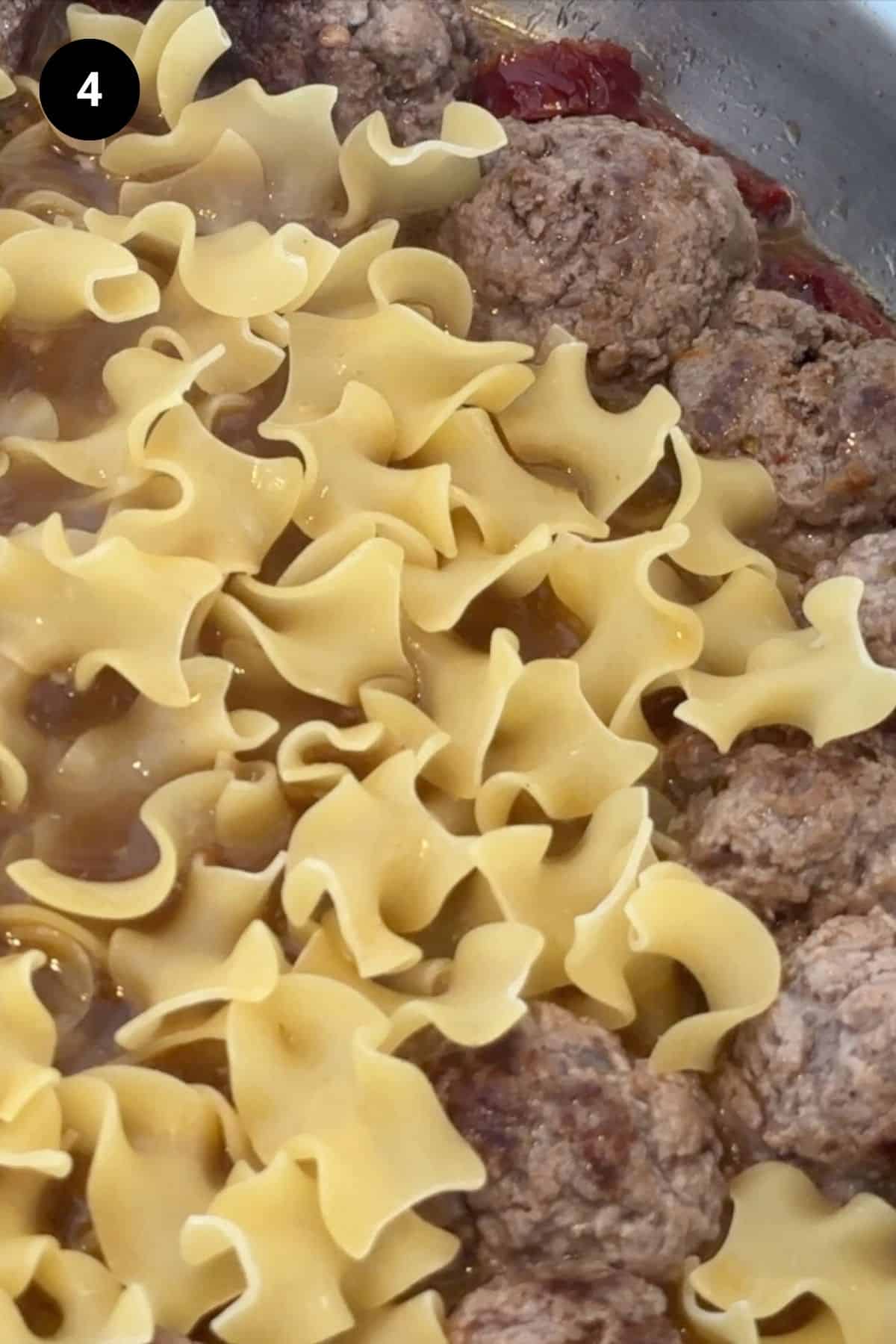 Pasta added to the meatballs.