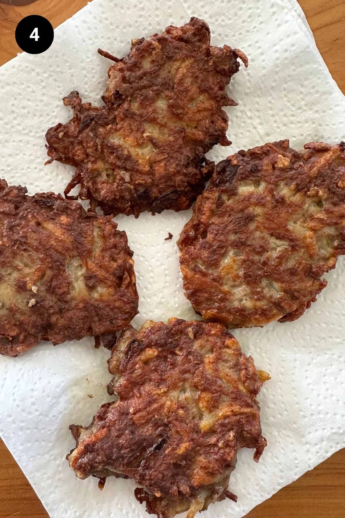 Beef fritters on a paper towel.
