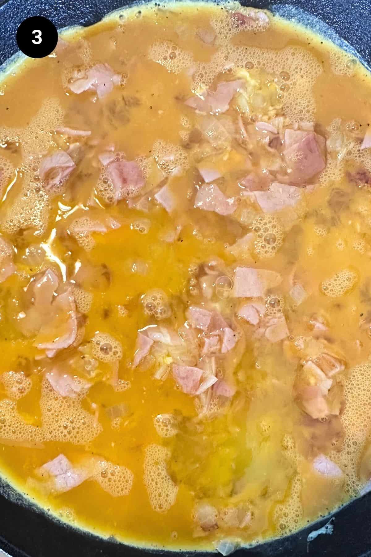 Egg mixture in a pan.