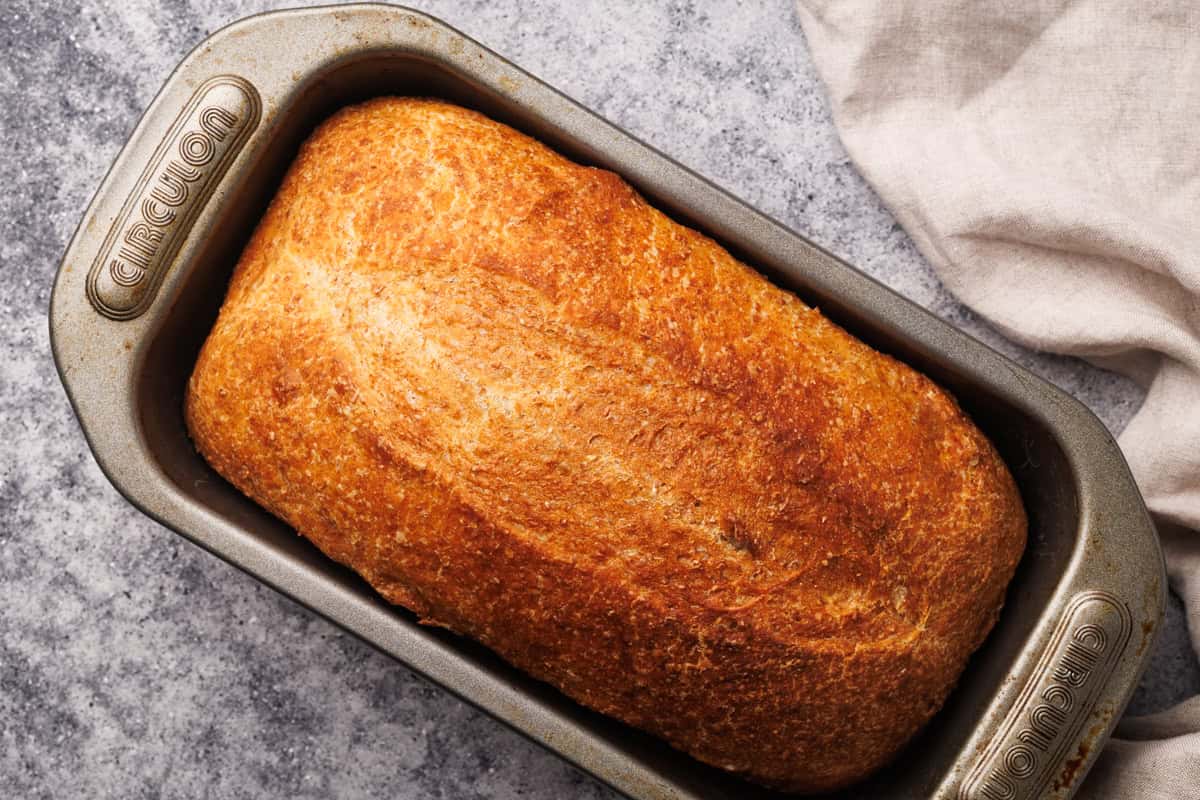Cold fermented bread in loaf tin after being baked.