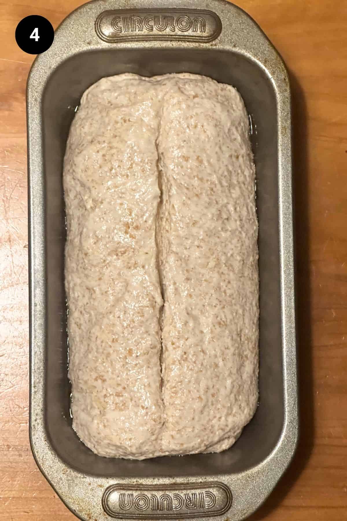 A cold fermented loaf in a loaf tin ready to be baked.