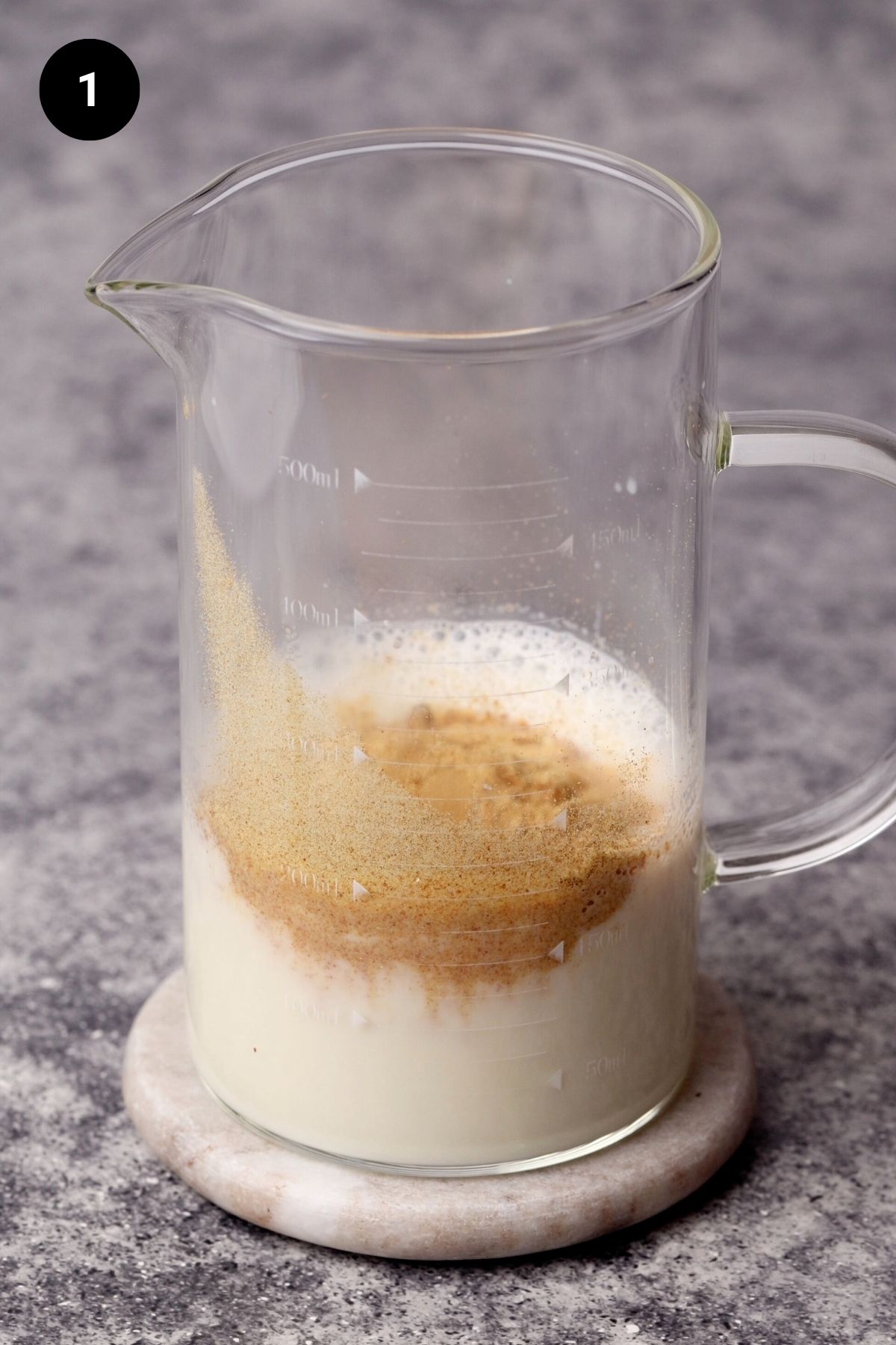 Milk and toasted milk powder in a jug.