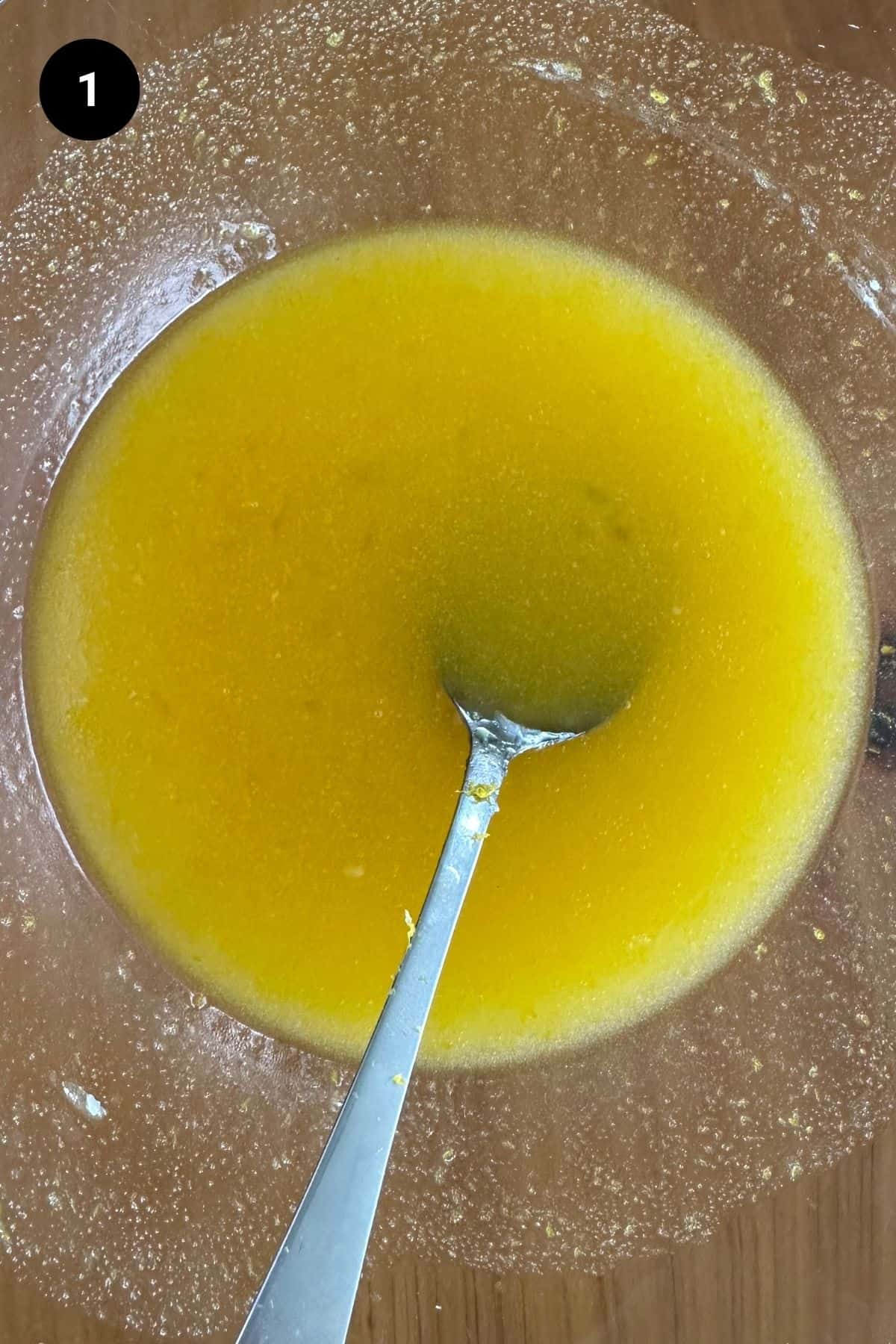 Wet ingredients combined in a glass bowl