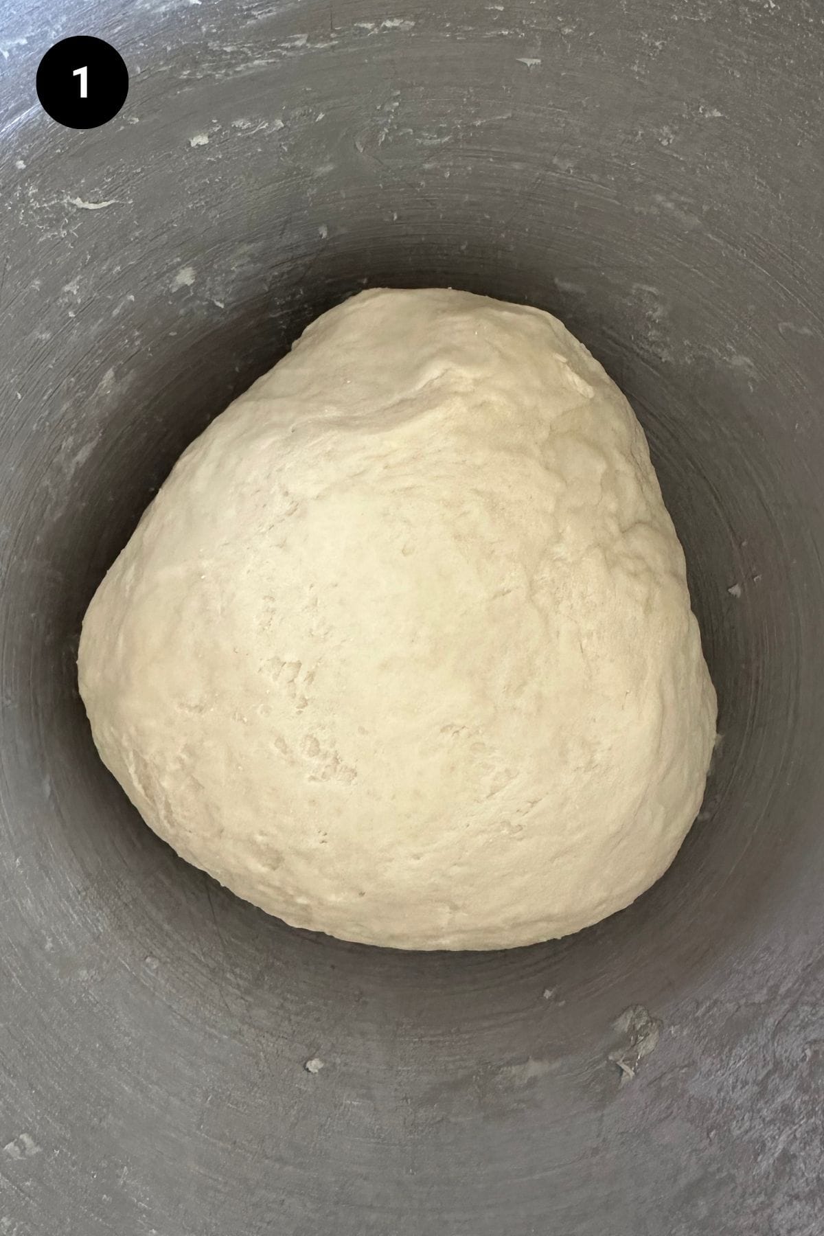 Dough in a metal bowl before the first rise.