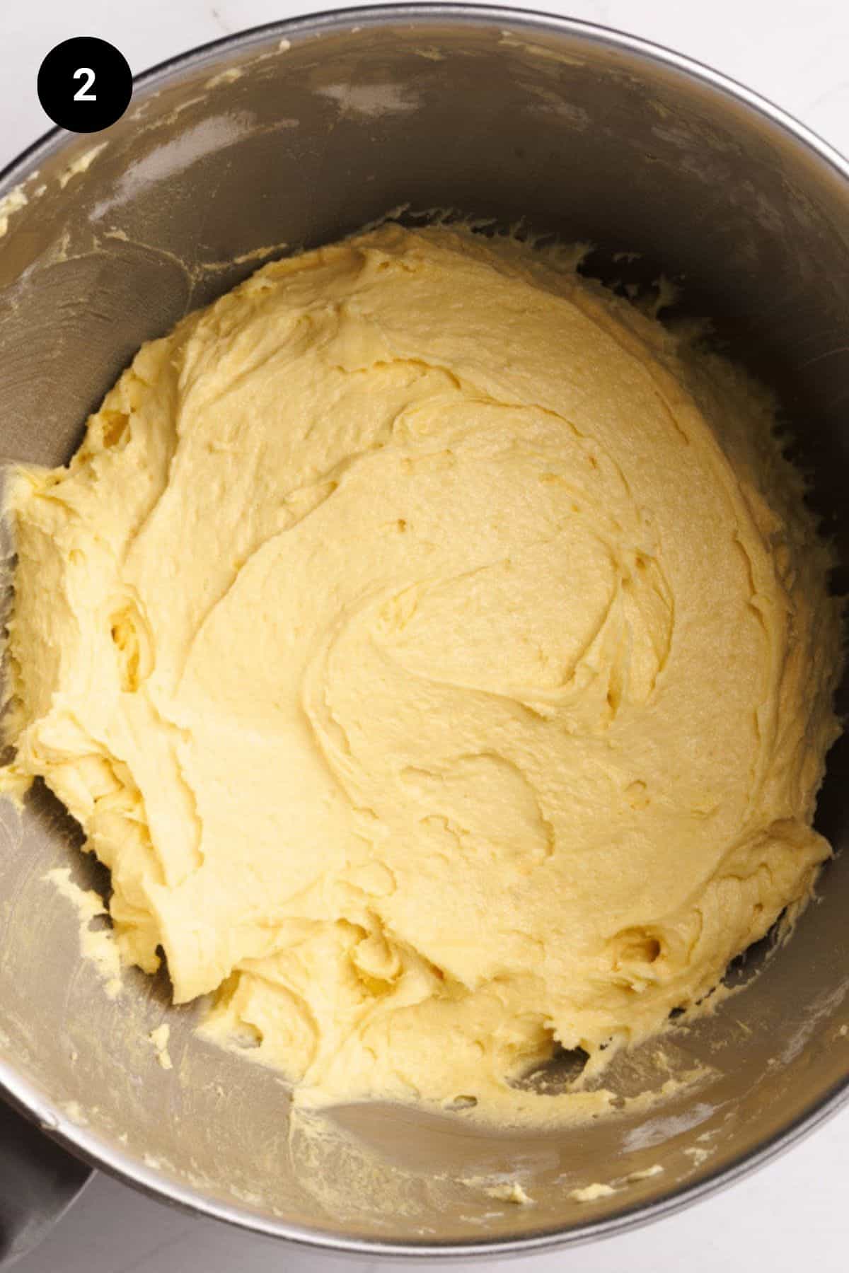 Lemon cake batter in a metal bowl.