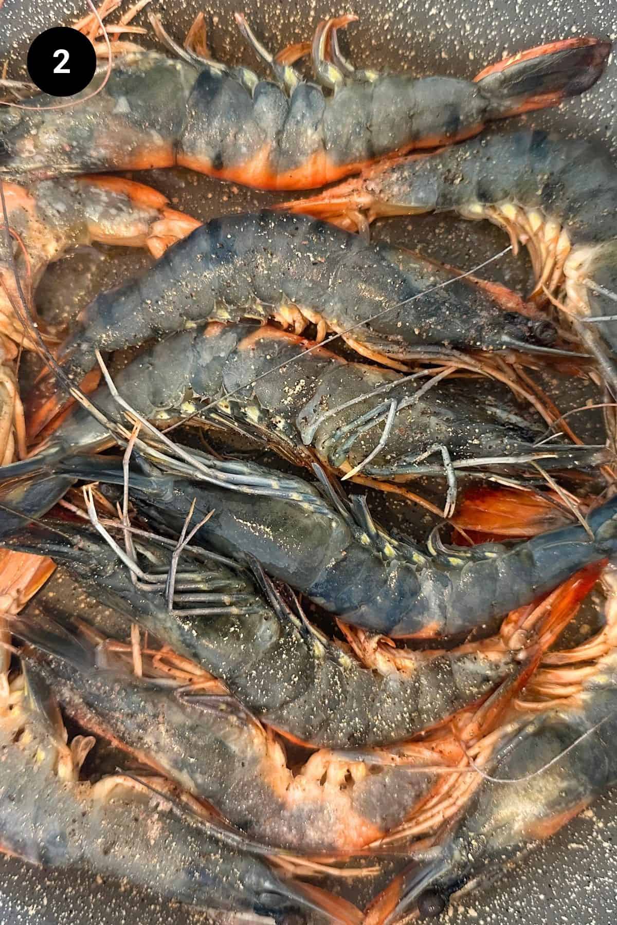 Tiger shrimp in pan changing color.