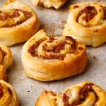 Baked lamb pinwheels on a baking sheet.