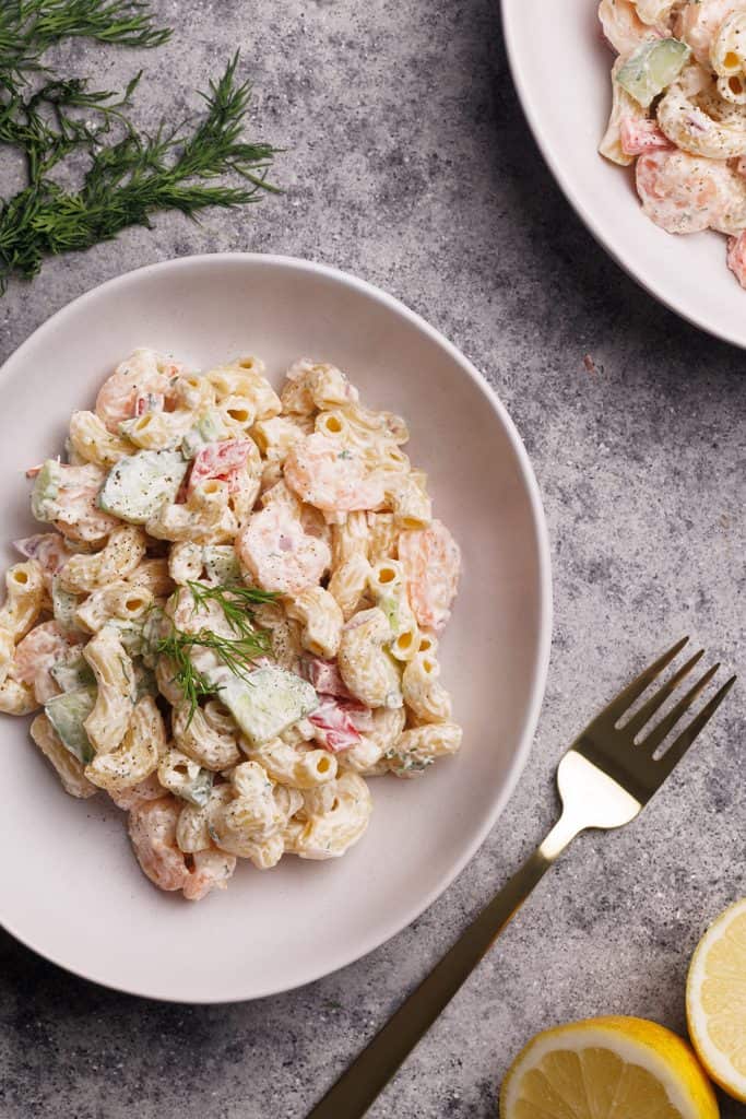 Shrimp macaroni salad in a white bowl.