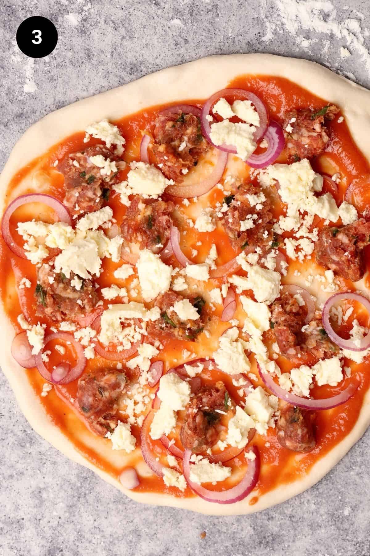 Toppings added to the pizza before baking.