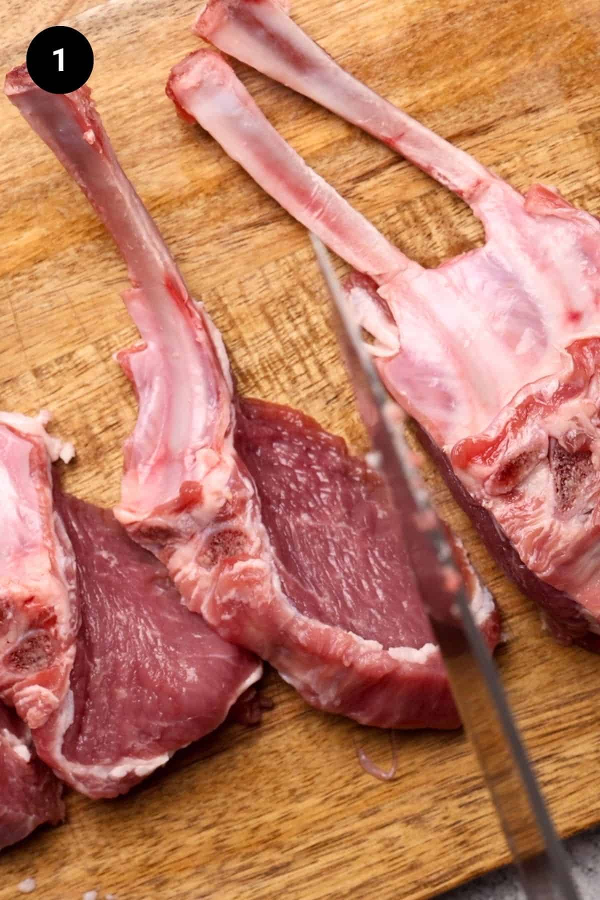 Rack of lamb being cut into chops.
