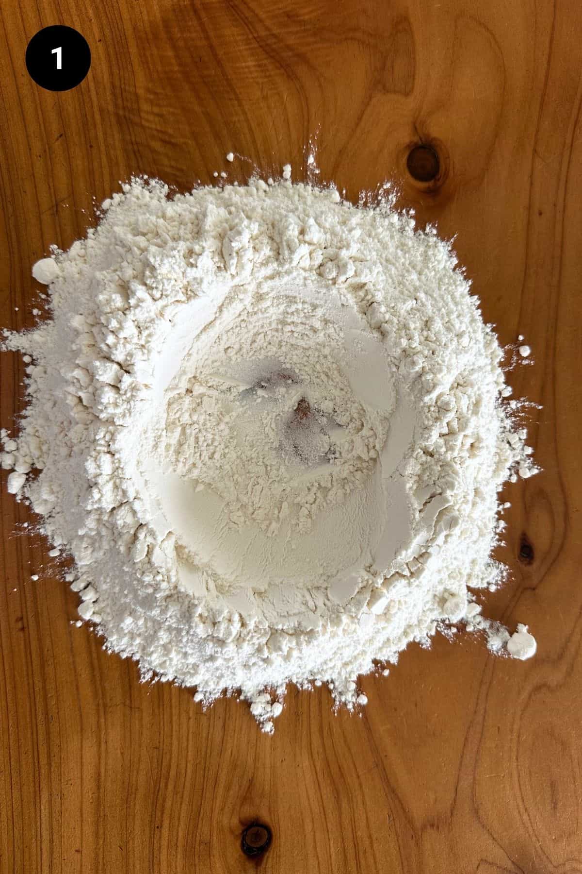 Flour shaped into a volcano.