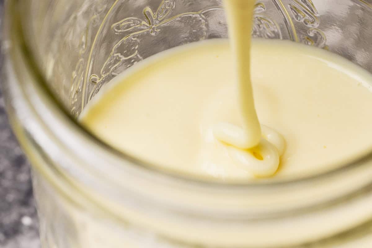 Close-up of the thick consistency of the evaporated milk.