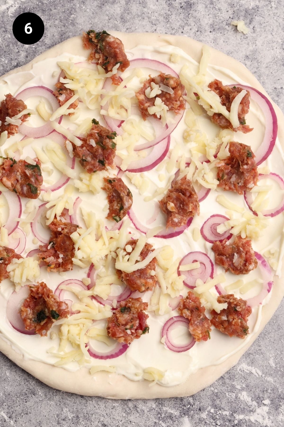 German pizza ready to be baked.