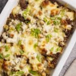 Hamburger and potato casserole in a large baking dish.