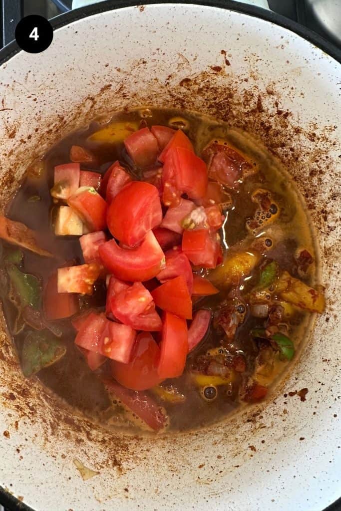 Tomatoes added to stock goulash base.