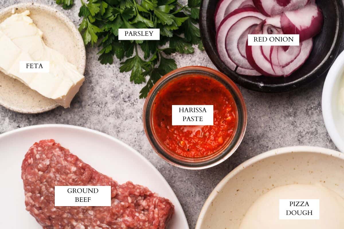Ingredients laid out to make Turkish pizza (Lahmacun).