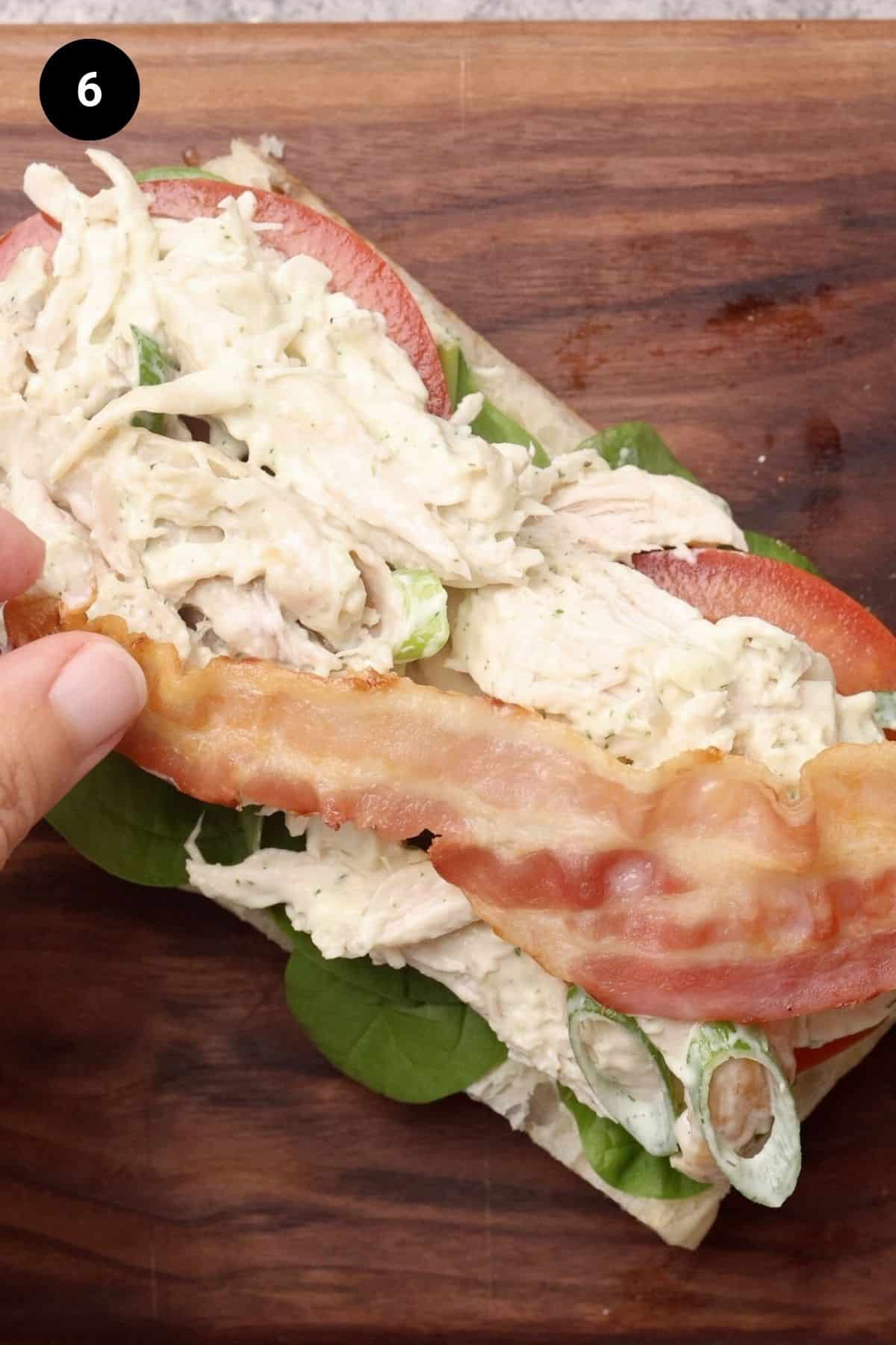 Chicken salad and crispy bacon added to the sandwich.