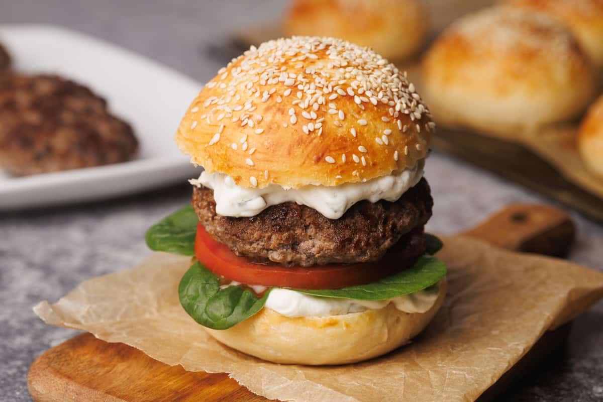 Hamburger on a wooden board.