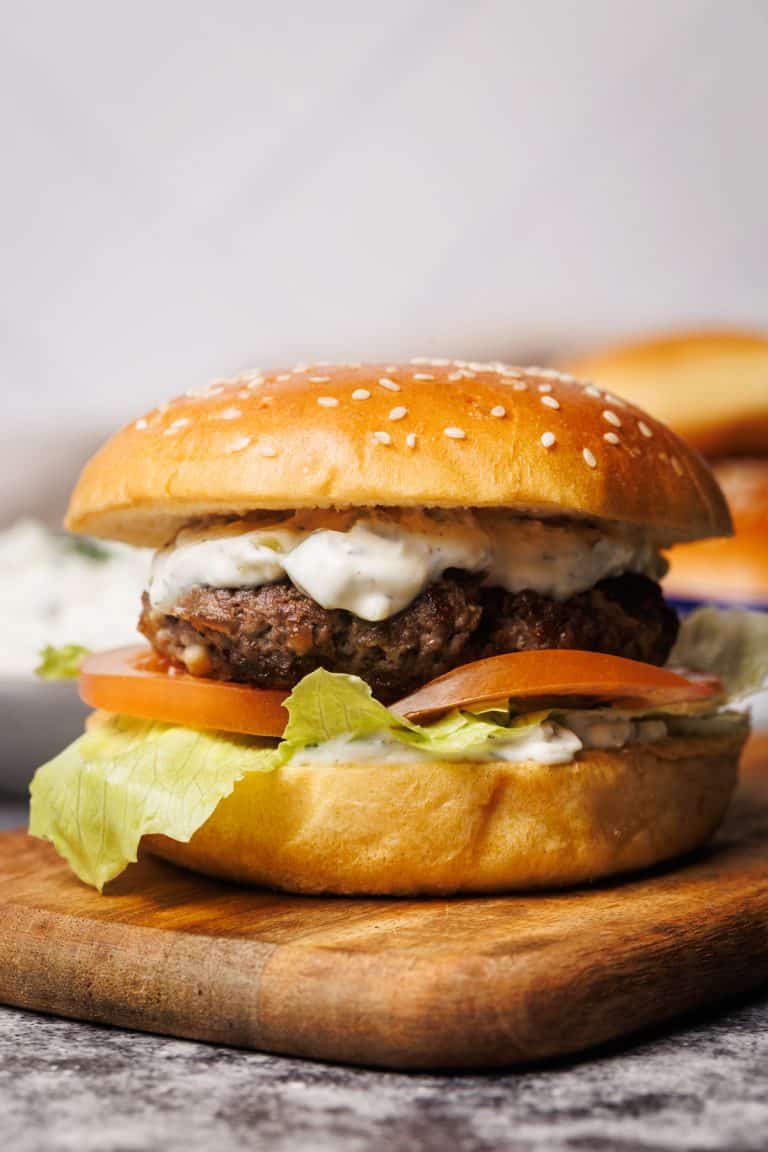 Hamburger on a wooden board.