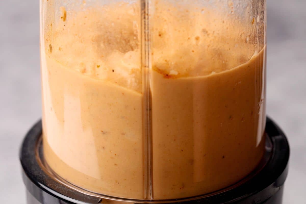 Hummus being blended.